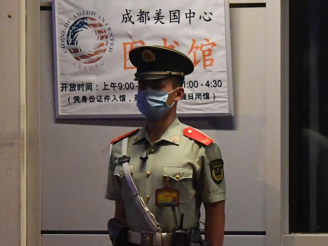 A policeman stands guard at the entrance to the US consulate in Chengdu. Picture: AFP