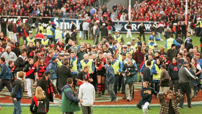 Bombers fans get around Matthew Lloyd after his milestone. 