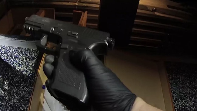 A hand gun found during the raid of a Paradise Point home