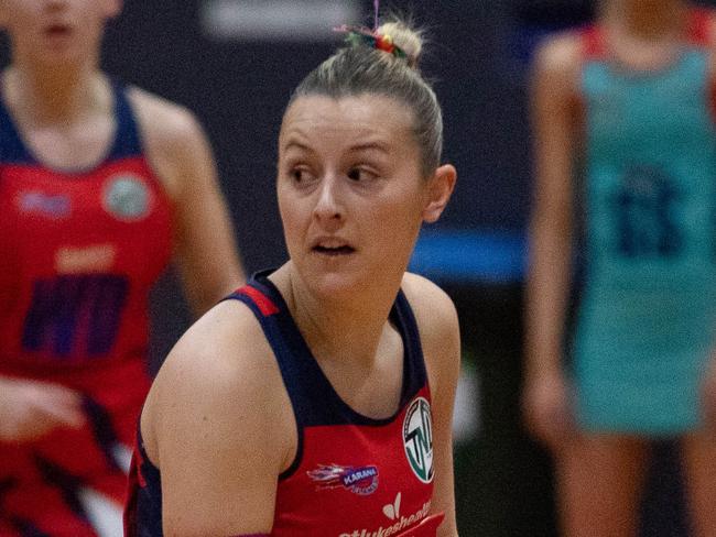 HOBART Sunday 16th June 2024. Tasmanian Netball League. Karana vs Devon at Hobart Netball Centre. Holly McConnon looks to pass for Karana Flames.Picture: Linda Higginson