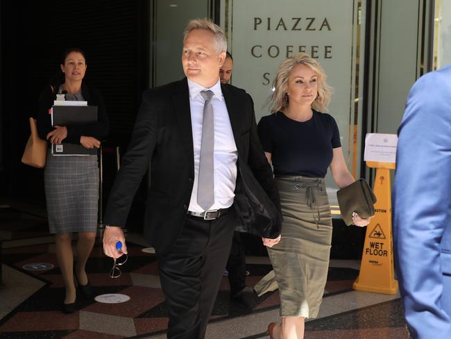 SYDNEY, AUSTRALIA - NewsWire Photos OCTOBER 13, 2020 -  Disgraced financial planner Sam Henderson with his partner leave the Downing Centre in Sydney on Tuesday, October 13, 2020.Picture: NCA NewsWire / Christian Gilles