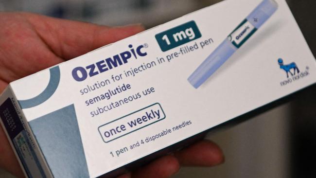 A pharmacy owner shows an Ozempic antidiabetic medicine at a pharmacy in Pristina on March 27, 2025. The antidiabetic medicine of Ozempic is surging in Kosovo as a quick-fix weight loss solution, driving up demand and sending prices soaring, despite warnings about possible side effects of the Diabetes drug. (Photo by Armend NIMANI / AFP)