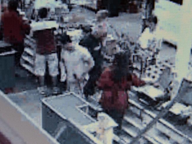 CCTV footage of Michael Atkins leaving the cash register at the Bunnings Store at Taren Point.