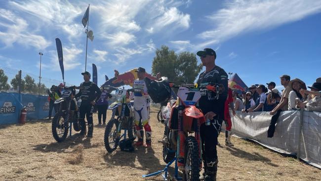 The top three at the finish line of the Finke bike race. 1st Walsh, 2nd Smith, and 3rd Simpson. Picture: (A)manda Parkinson