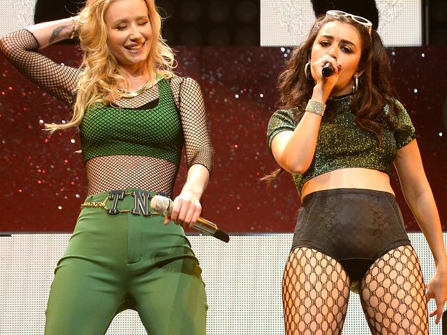 MIAMI, FL - DECEMBER 21: Charli XCX (L) and Iggy Azalea perform onstage during Y100's Jingle Ball 2014 at BB&T Center on December 21, 2014 in Miami, FL. (Photo by Larry Marano/Getty Images for iHeartMedia)