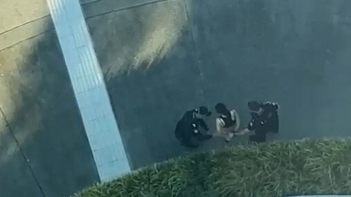 The scene of an alleged stabbing on the Cairns Esplanade on November 24. Police later charged 20-year-old Isabella Aneta Cisarova with attempted murder. Ms Cisarova is pictured here being placed under arrest. Picture: Supplied