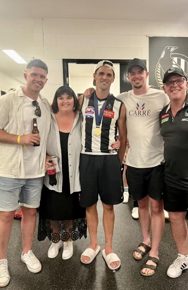 Collingwood great Scott Pendlebury with family, including Kris (left), after winning the 2023 grand final against the Brisbane Lions.