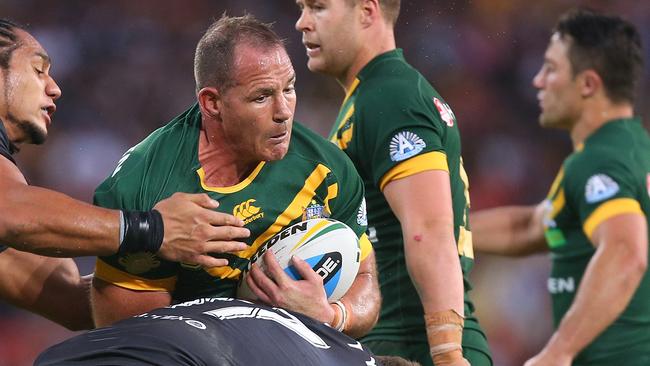 BRISBANE, AUSTRALIA - MAY 03: Matt Scott of Australia is tackled during the Trans-Tasman Test match between the Australia Kangaroos and the New Zealand Kiwis at Suncorp Stadium on May 3, 2015 in Brisbane, Australia. (Photo by Chris Hyde/Getty Images)