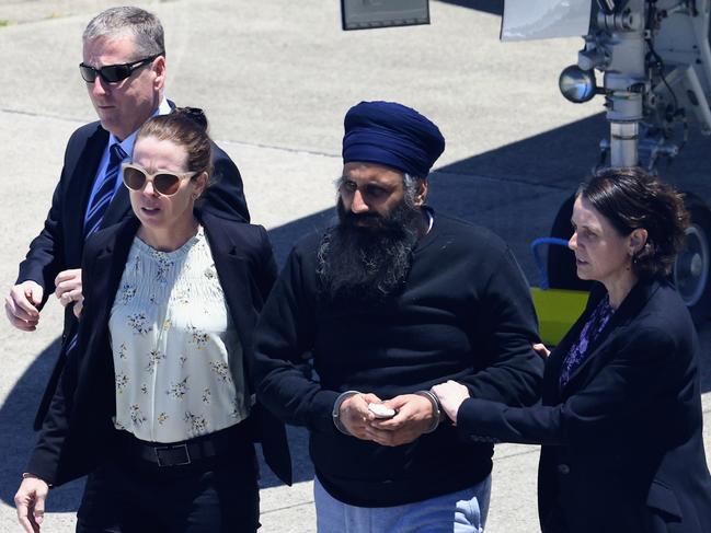 Rajwinder Singh after being extradited from India on a chartered flight. Picture: Brendan Radke