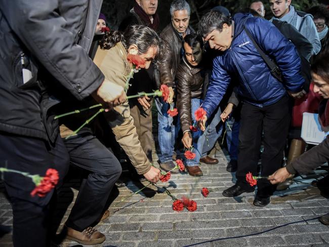 Tribute ... members of the Turkish medical association lay flowers in Istanbul's tourist hub of Sultanahmet where at least 10 people were killed and 15 wounded in a suspected terrorist attack. Picture: AFP/Ozan Kose