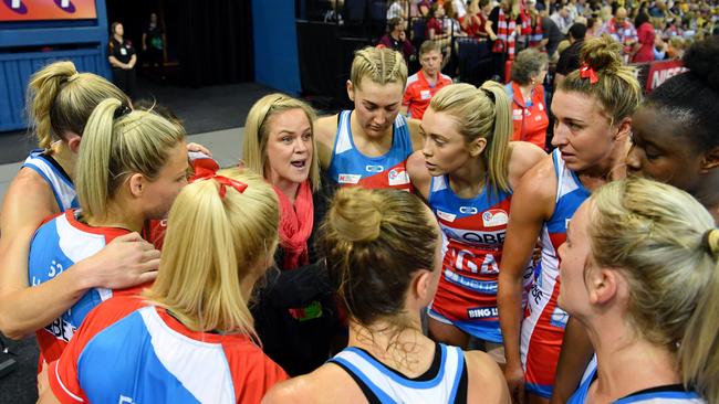 Swifts coach Briony Akle (centre) has re-signed.