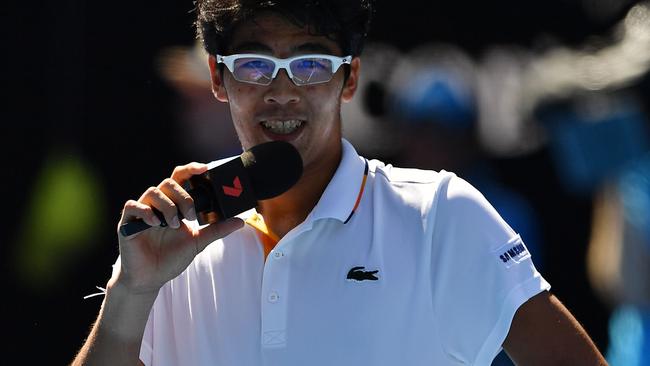 Hyeon Chung talks to the crowd after his quarter-final win. Picture: AFP