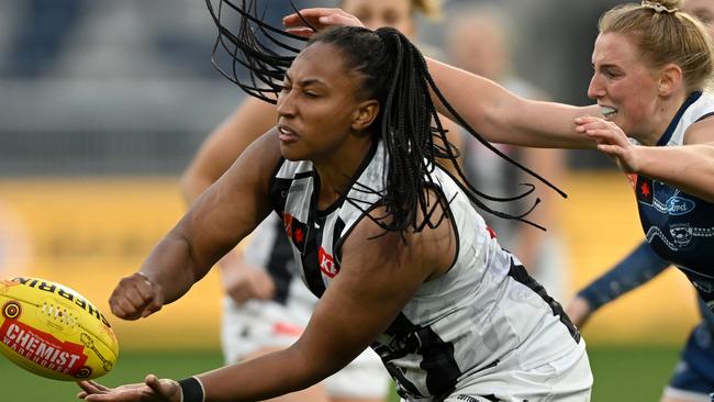 Sabrina Frederick handpasses the ball against the Cats. Picture: Morgan Hancock/AFL Photos/via Getty Images