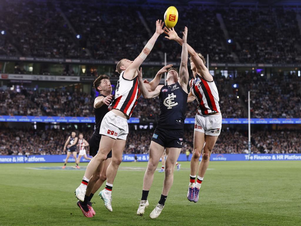 Callum Wilkie and Mason Wood of the Saints defend Blake Acres of the Blues during the game. Picture: Darrian Traynor/Getty Images