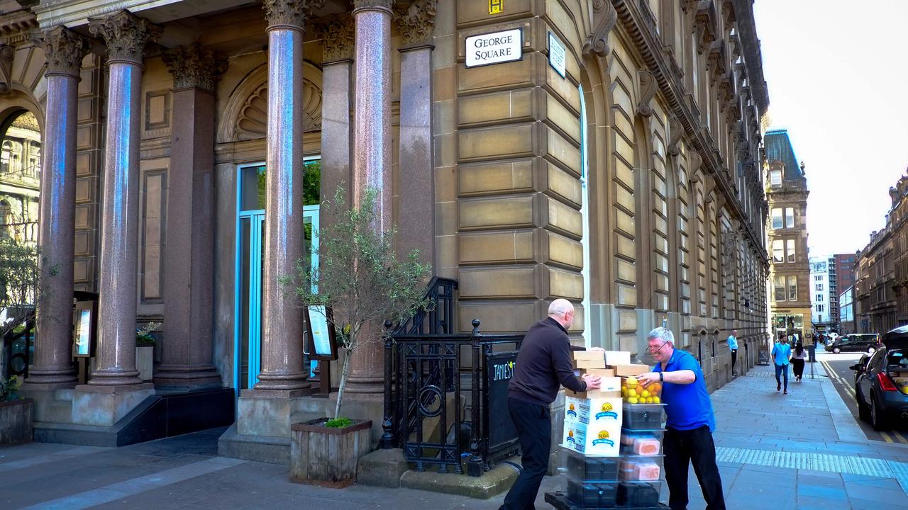 Men take away stock from a closed-down<i/>Jamie's Italian restaurant in Glasgow. Picture: Andy Buchanan