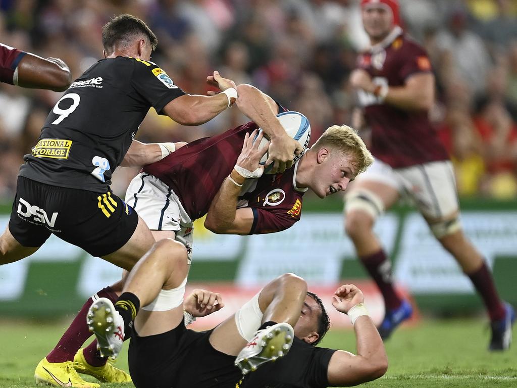 Tom Lynagh attempts to break away from the Hurricanes’ defence. Picture: Ian Hitchcock / Getty Images