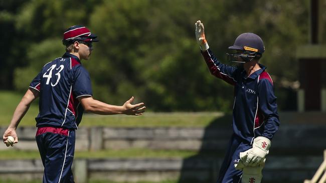 TSS First 11 celebrate the 2nd BSHS wicket of Calem McCathie, caught behind as The Southport School v Brisbane State High School at The Southport School/Village Green. Picture: Glenn Campbell