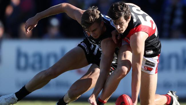 Chris Burgess fights Port’s Dougal Howard for the ball while playing for West Adelaide. Picture: Calum Robertson