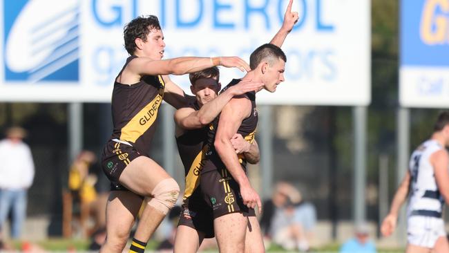 Tiger Matthew Allen is congratulated by teammates Brady Searle (left) and Jonty Scharenberg after kicking one of his three goals against South Adelaide. Picture: Cory Sutton/SANFL