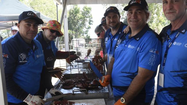 Best mates hooking into a big day of food prep at Darwin's 2024 Greek GLENTI festival.