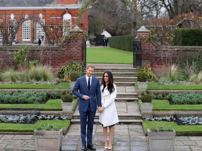 Prince Harry and his fiance US actress Meghan Markle posing for a photograph in the Sunken Garden at Kensington Palace in west London on November 27, 2017, following the announcement of their engagement. Picture: AFP/Daniel Leal-Olivas