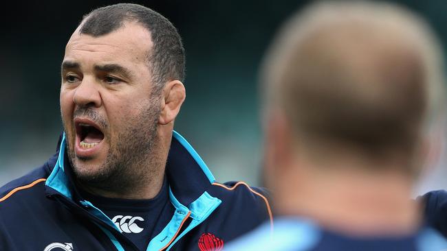 SYDNEY, AUSTRALIA - MAY 18: Waratahs coach Michael Cheika talks to players as they warm up during the round 14 Super Rugby match between the Waratahs and the Lions at Allianz Stadium on May 18, 2014 in Sydney, Australia. (Photo by Cameron Spencer/Getty Images)
