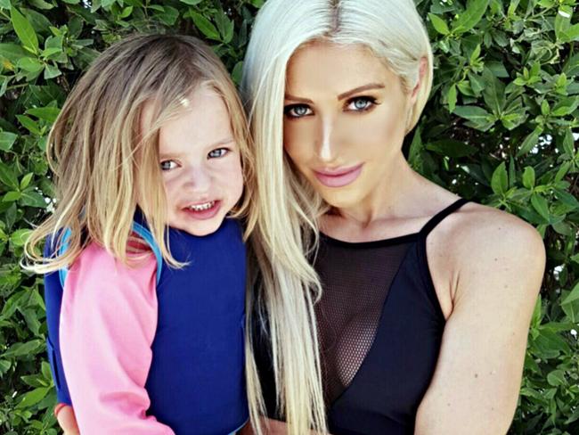 Simone Gately and one of her daughters. Picture: Caters News