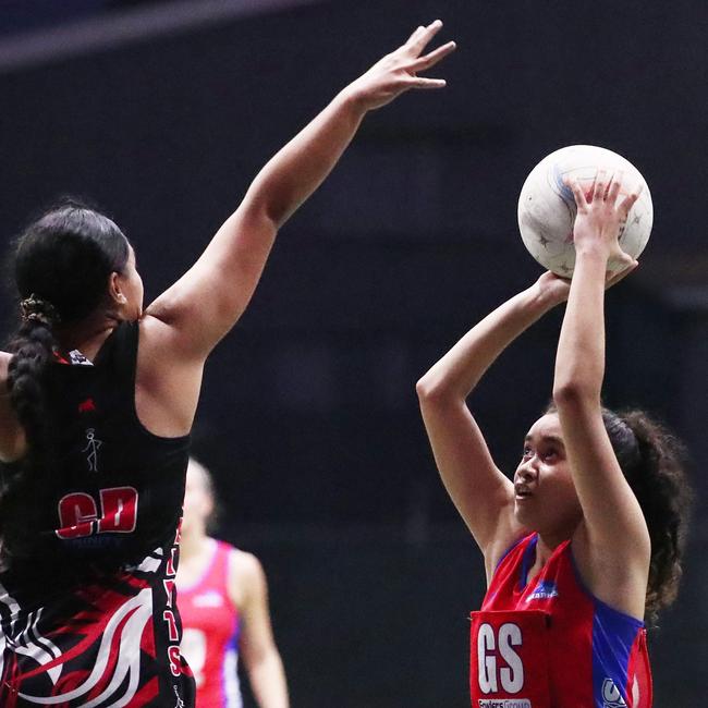 Sharks' Allessandra Smith-Ani shoots the ball in the Cairns Netball Association Senior Division 1 match between Cairns Saints and Sharks. PICTURE: BRENDAN RADKE