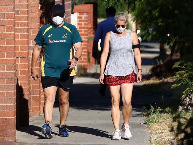 A couple take an early morning walk in Perth, Australia as lockdown enters its second day. Picture: Getty