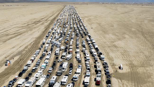 Vehicles are seen departing the Burning Man festival in Black Rock City. REUTERS/Matt Mills McKnight