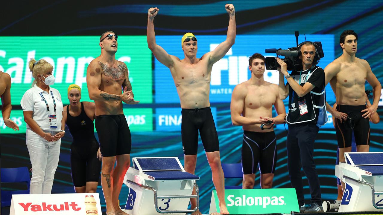 Kyle Chalmers is congratulated by Jack Cartwright. Photo by Dean Mouhtaropoulos/Getty Images.