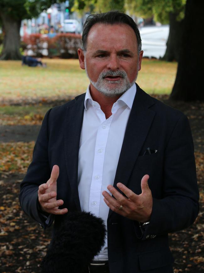 Labor MP David O'Byrne speaks to the media on Parliament Lawns in Hobart.