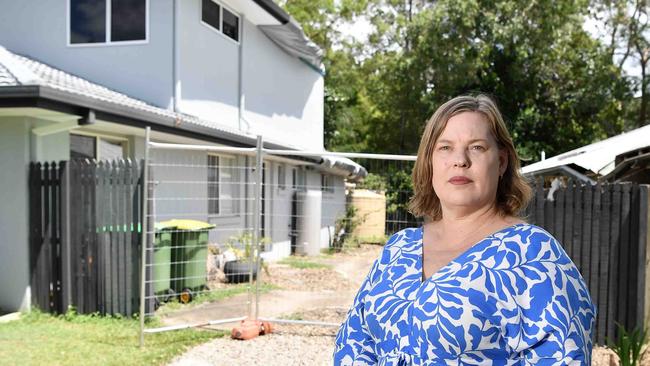 Arana Hills resident Jodie Davis has been forced out of her home after a tree from a neighbouring property crashed through the roof, triggering a dispute over who owns the tree. Picture: Patrick Woods.