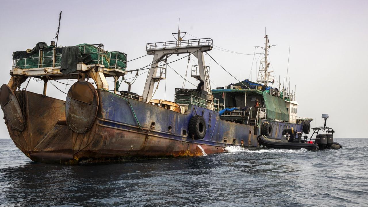 Chinese ship FV Shanghai 9 being seized off the coast of the Liberia during a joint operation by the Liberian coastguard and Sea Shepherd after they were found illegally fishing in 2017. Picture: AFP PHOTO/Sea Shepherd Global.