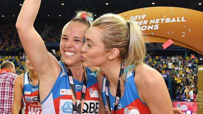 Paige Hadley (left) and Helen Housby (right) celebrate winning the Super Netball crown.