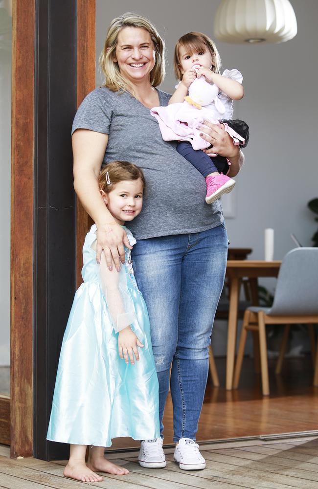 Libby Trickett poses with her daughters Poppy, 4, and Edwina, 18 months in Brisbane. Picture: Claudia Baxter.