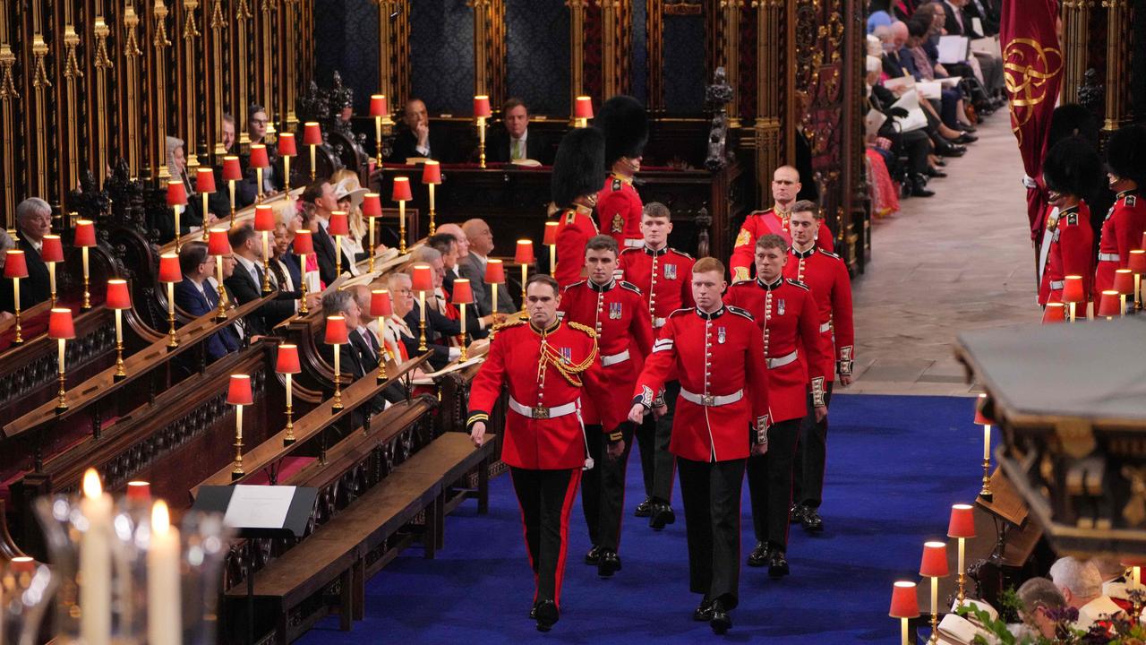 Service personnel from the Regiments of the Household Division arrive inside Westminster Abbey. Picture: AFP