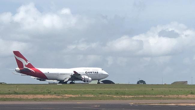 Qantas Flight QF6032 carrying the second group of coronavirus evacuees from China's Wuhan lands in Darwin on Sunday. Picture: Pete Washington