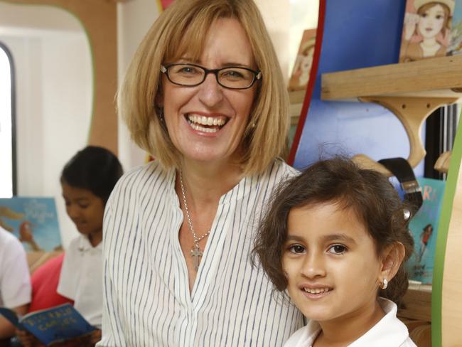 Russ the Bus visited Widemer Public School at Greystaynes with childrens author Katrina Nannestad to give the kids some books. She is pictured with Alisha Raihan 6 inside the bus.