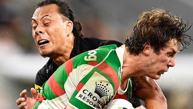 TOWNSVILLE, AUSTRALIA - SEPTEMBER 11: Campbell Graham of the Rabbitohs is tackled by Jerome Luai and Matt Burton of the Panthers during the NRL Qualifying Final match between Penrith Panthers and South Sydney Rabbitohs at QCB Stadium, on September 11, 2021, in Townsville, Australia. (Photo by Ian Hitchcock/Getty Images)