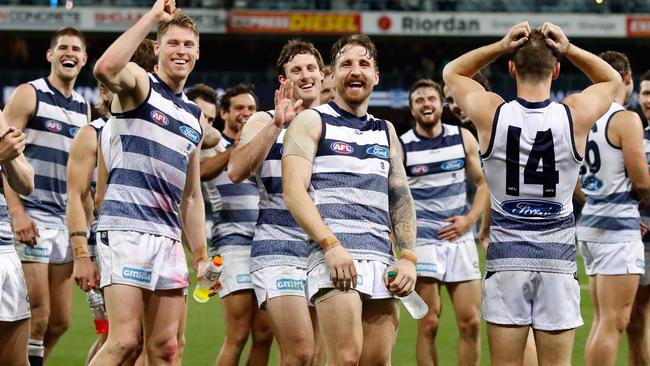 Zach Tuohy and the Cats come together after the final siren to enjoy Friday night’s win. Picture: Getty Images