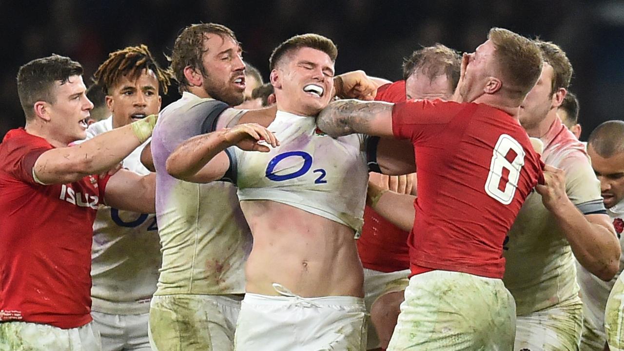 England and Wales players scuffle during a Six Nations match in 2018.