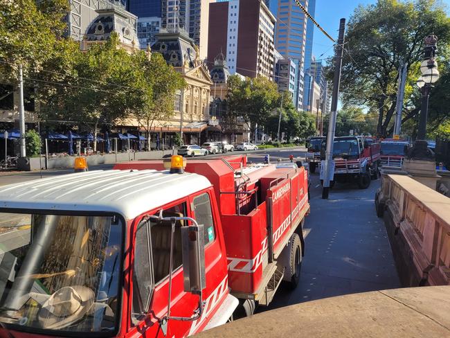 Firetrucks line Spring St as firefighters gather to protest. Picture: Brendan Kearns