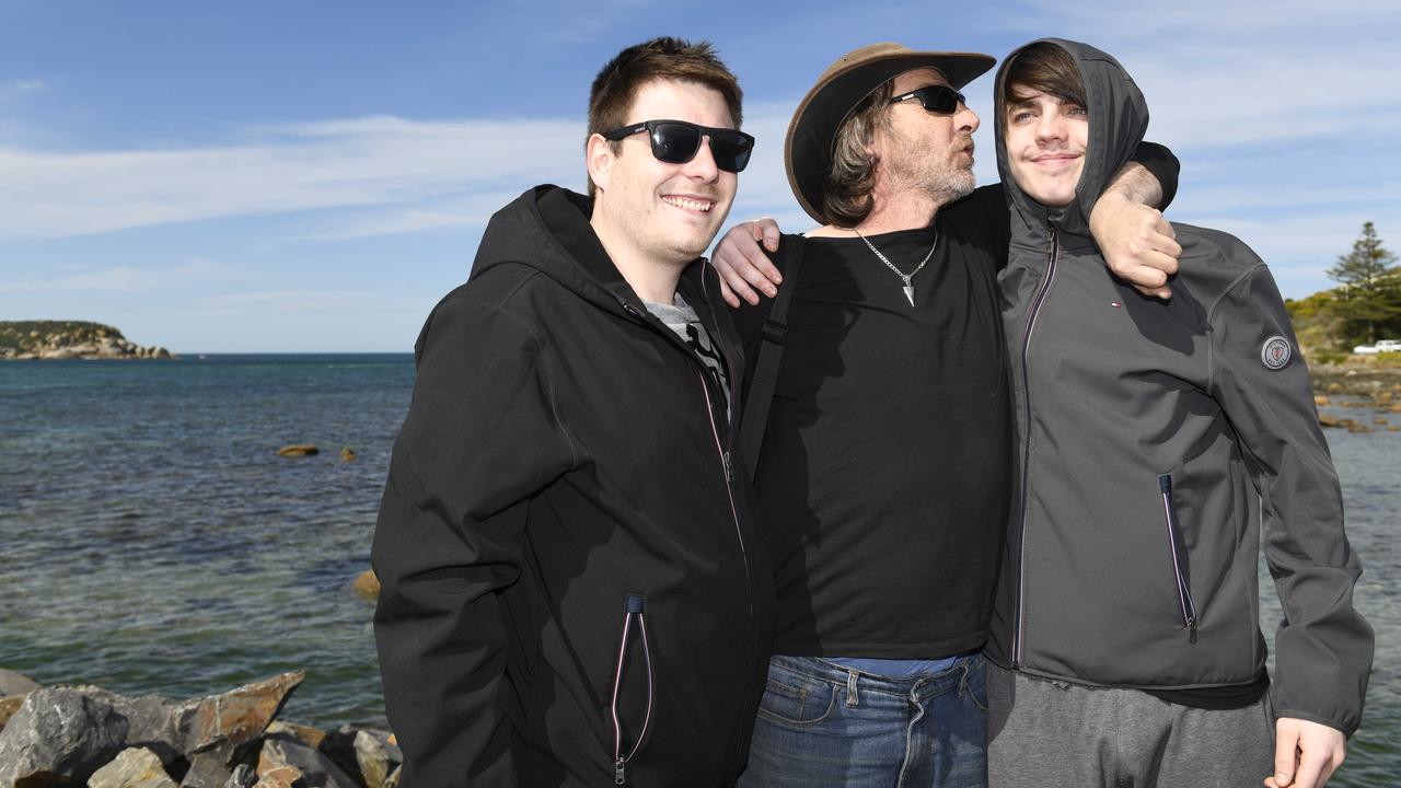 Derek Robinson is reunited with his family as he disembarks on to Granite Island. Picture: NCA NewsWire / Picture: Naomi Jellicoe