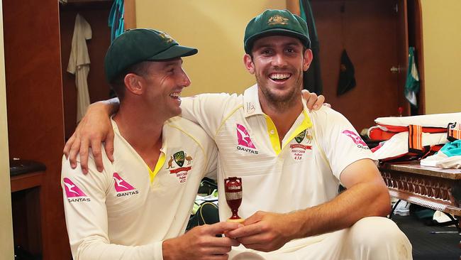 Brothers Shaun (left) and Mitchell Marsh with a replica of the Ashes urn after Australia win at the SCG on Monday.