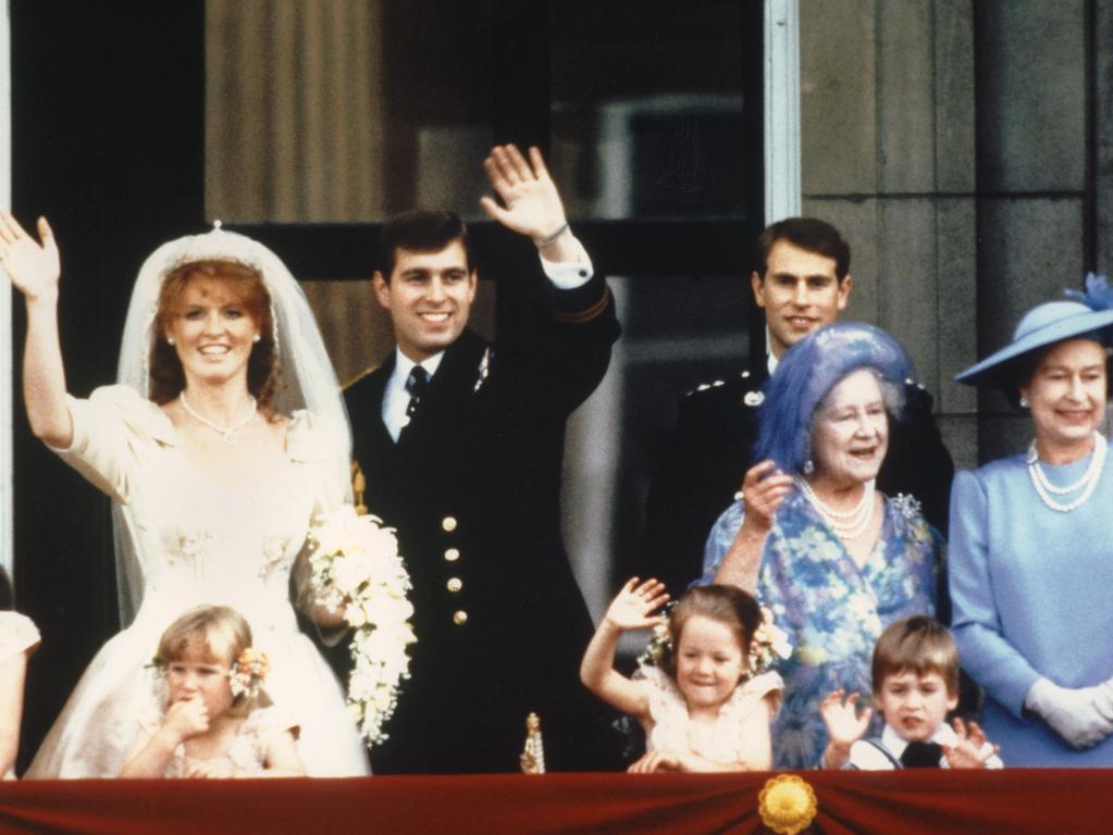 The newly wed Prince Andrew, the Duke of York and his wife Sarah Ferguson, the Duchess of York, wave to crowds 23 July 1986 from the balcony of Buckingham Palace in London.  Picture:  AFP