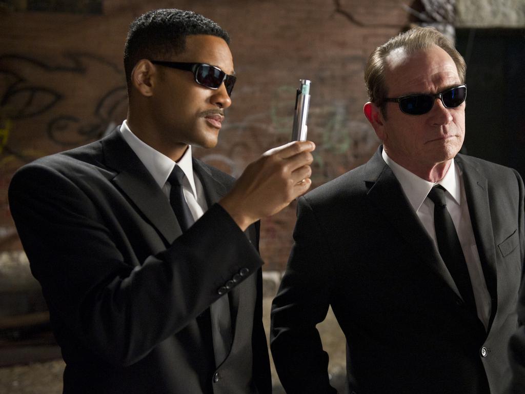 Jones in a scene from <i>Men In Black 3</i> with co-star Will Smith.