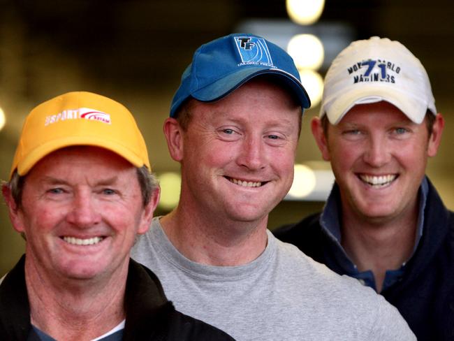 Trainers John Hawkes (C) with sons Wayne (blue cap) and Michael at their Rosehill Stables in Sydney, are joint trainers of racehorse and Golden Slipper favourite Real Saga.