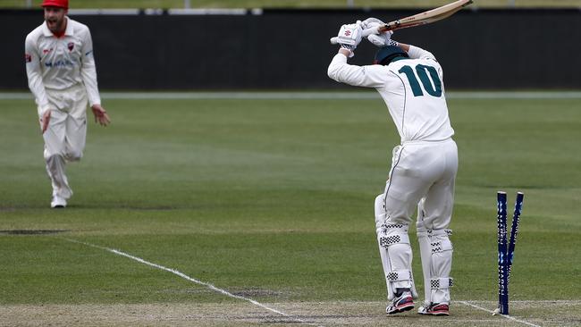 Tasmanian batsman George Bailey is bowled first ball by Wesley Agar. Picture: AAP/LEIGH WINBURN