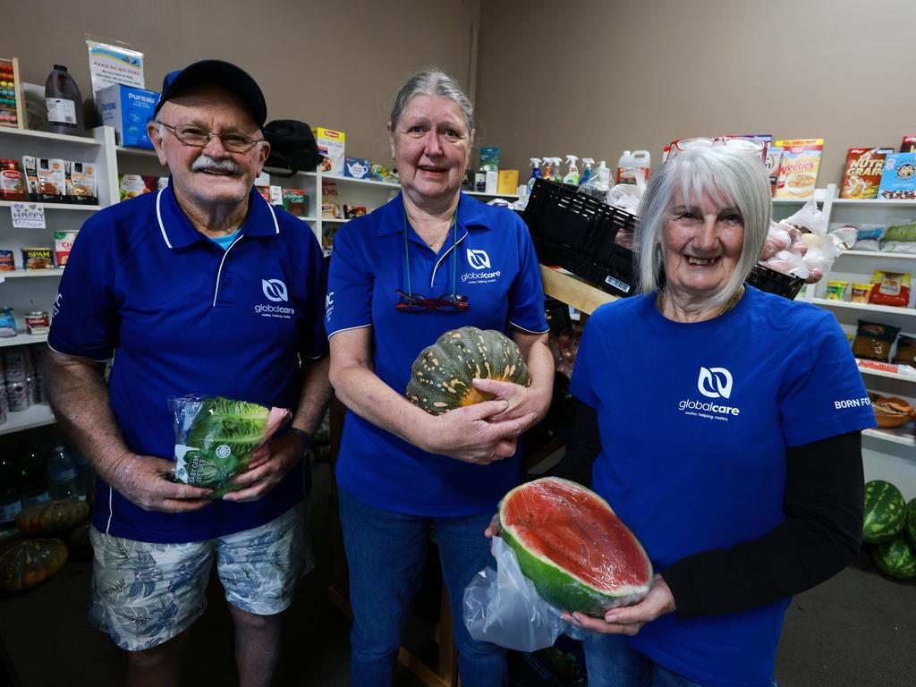 The supplied, donated by The Daily Telegraph, will be used to stock a local community pantry in Taree for flood victims. (Left to right) Volunteers Mick Brooks, Debbie Burham and Lyn Iverson from Global Care. Picture: Scott Calvin